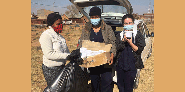 Physiotherapy students Nina Simon and Kgomotso Mosebedi deliver essential goods